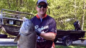 Brandonn Kramer with Michigan bowfishing record black buffalo from Grand River in Ottawa County in May 2018 Photo Michigan DNR horiz