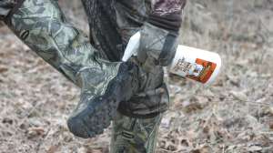 BW1131 Hunter using scent spray to erase human odor copyright Mark Kayser