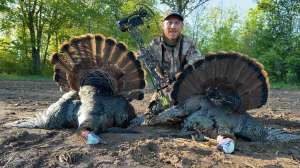 Mc Dougal with two turkeys