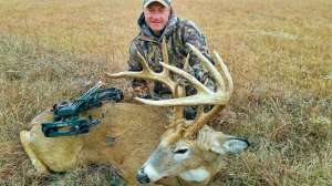 Web Mark Kayser is all smiles after success on a buck that showed up from nearby posted land on his Midwest bowhunt copyright Mark Kayser