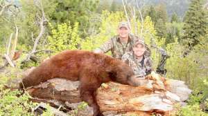 Derrick Nawrock and Jason with Bear in field with Jasons Bear