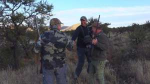 Hunters shaking hands lead