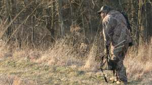 PH203 Predator hunter sneaking into calling position using terrain as cover copyright Mark Kayser