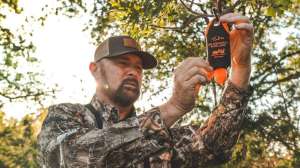 Tinks hunter placing deer scent