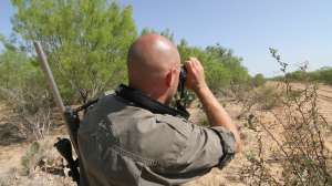 Wildlife Systems guide Gabe Price scans a serendero copyright Mark Kayser