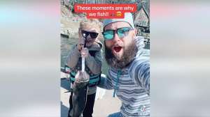 Father and son with big bass
