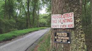 No trespassing sign and road