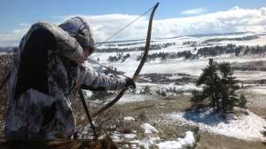 Person shooting traditional bow