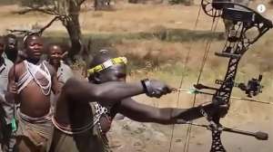 Web African tribe trying compound bow