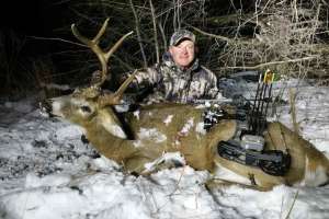 Web BW2085 Mark Kayser bowkilled whitetail in wicked weather edt copyright Mark Kayser
