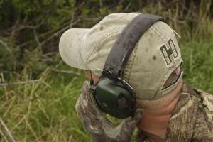 Using hearing protection while calling coyotes copyright Mark Kayser